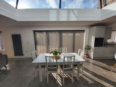 Chainless vertical blind fitted in front of a Bi-Fold door in Ipswich